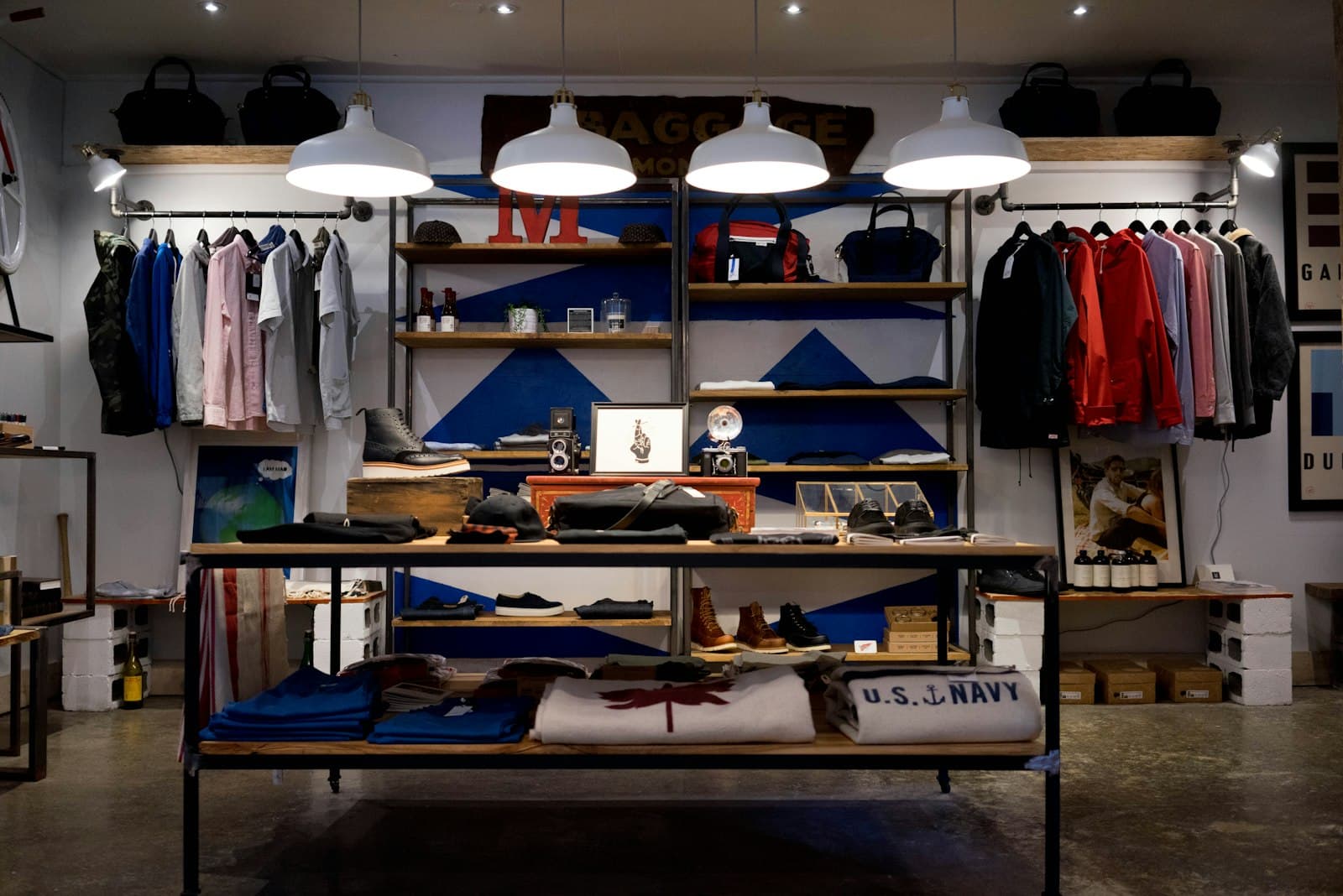 A menswear store interior with racks of shirts and jackets